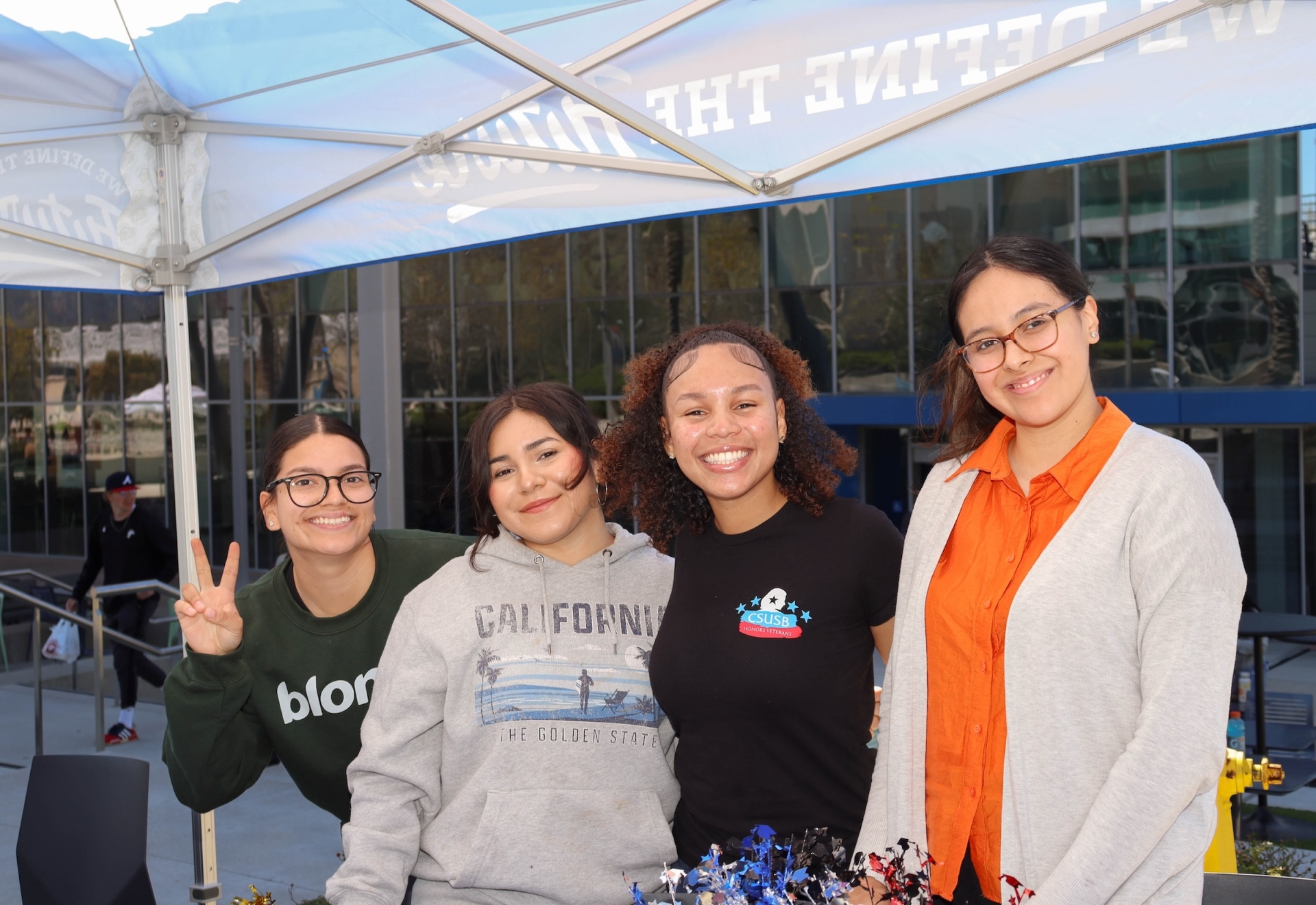 Justus Baker-Postell exhibits her leadership and passion for community building with other students at the Veteran Success Center’s She Served Cookout.